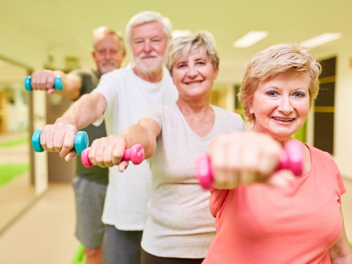 Sporty,Senior,Group,With,Dumbbells,For,Rehabilitation,For,Muscle,Building