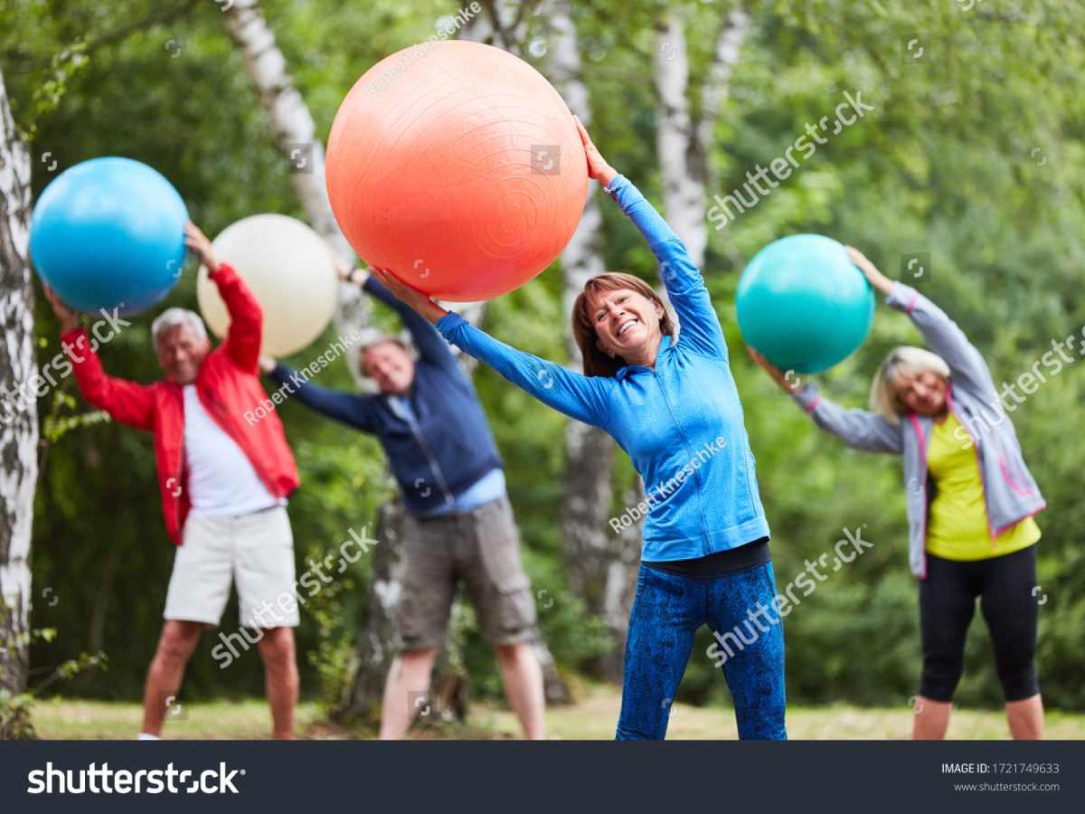 stock-photo-active-seniors-group-with-exercise-ball-doing-a-back-exercise-together-1721749633
